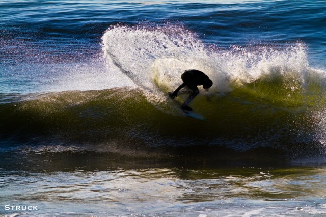 brian parnagian surfing in new jersey. jetty. backside surfing. backside turn. goofy foot.