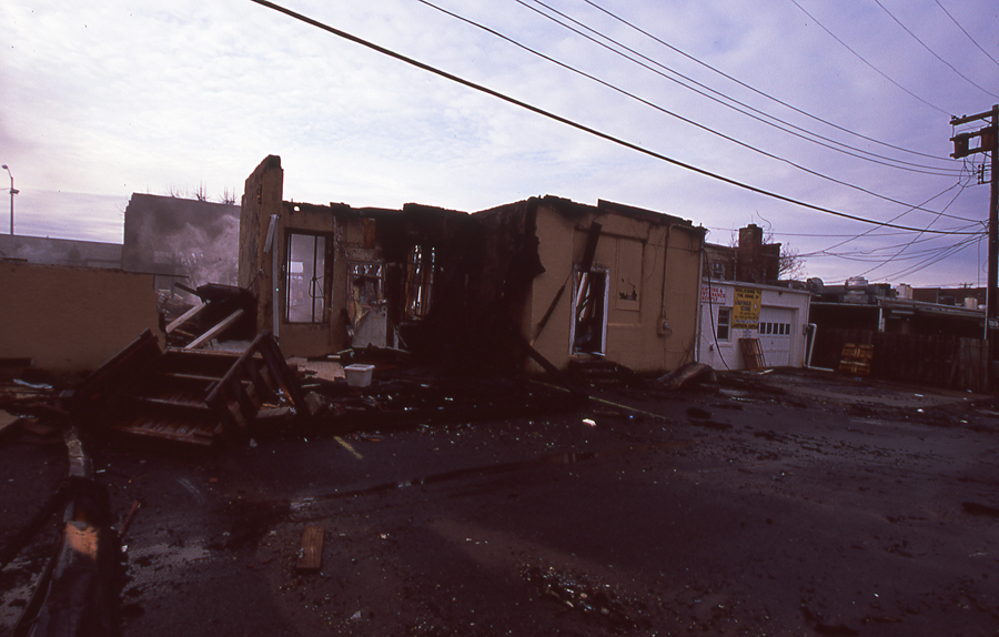 smoldering store fire. long branch. new jersey. photos of long branch fire. apartment fire. new jersey fire photography. 35mm film.