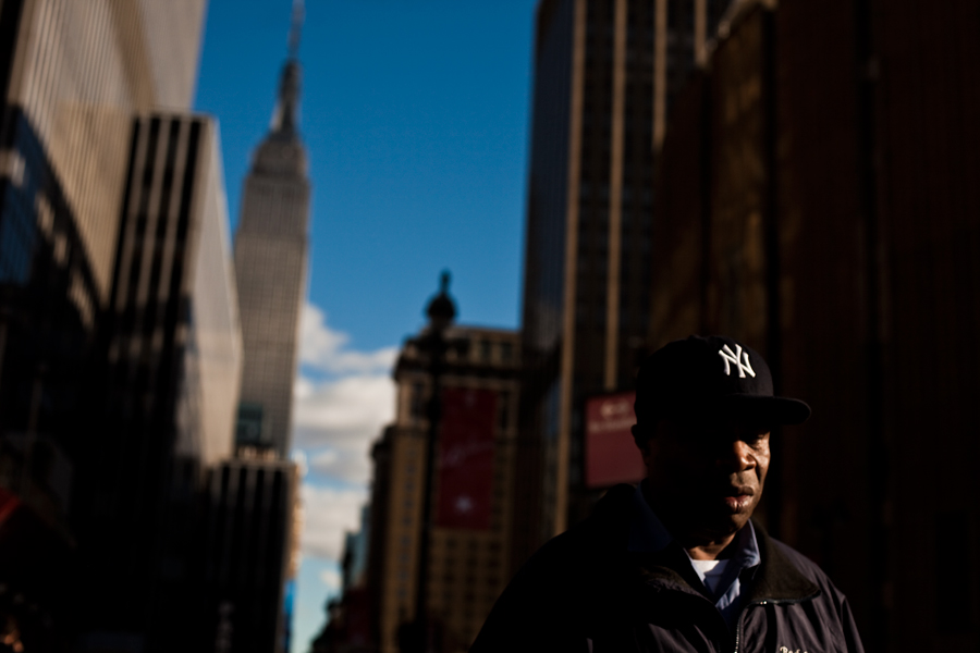 new york city. street photography. fall fashion. street advertisment. november 2013. what are people wearing. new york photographer. empire state building. penn station. yankee hat.