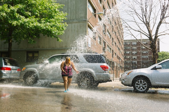 residents in brooklyn open up a fire hydrant to cool down during a new york heatwave